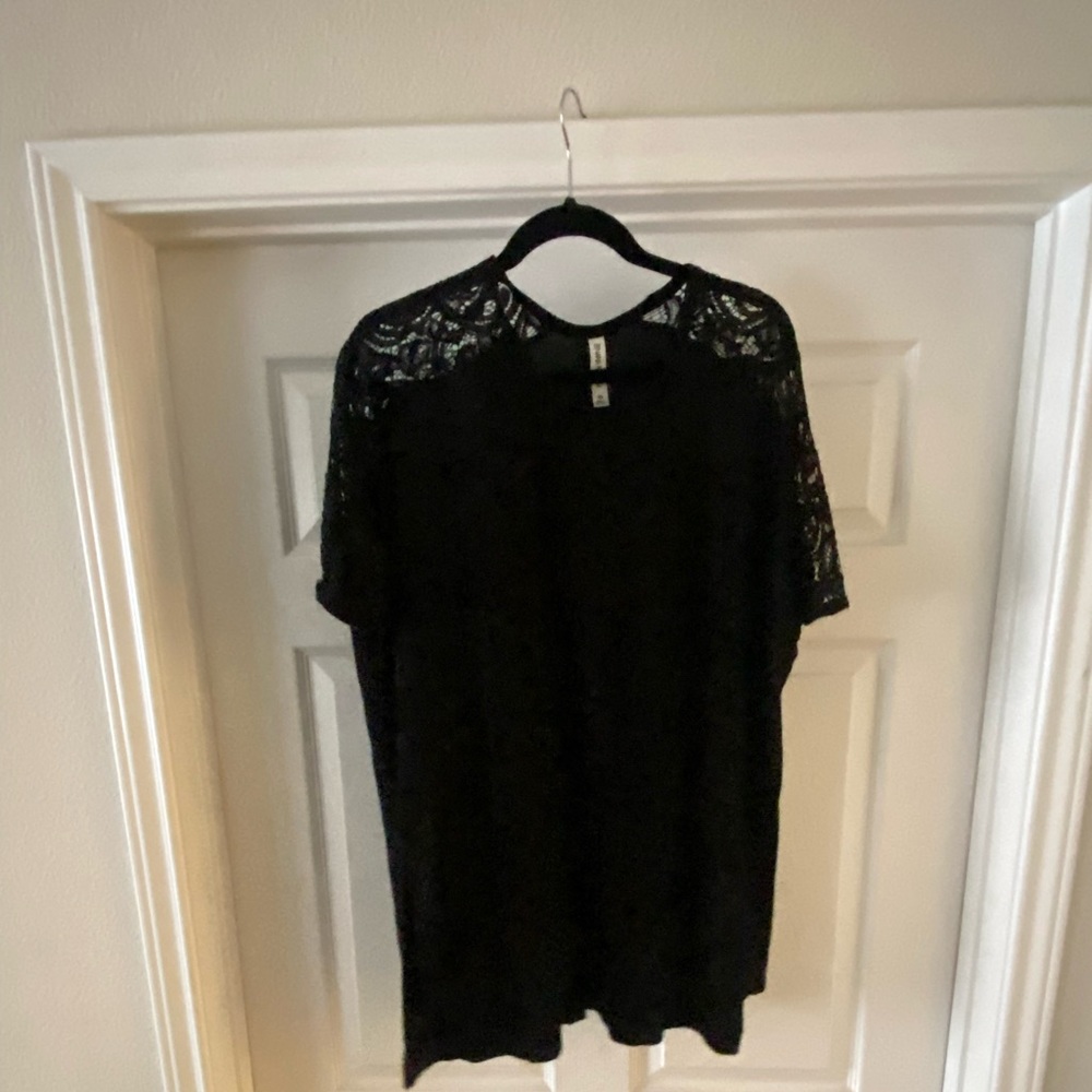 Brand new! Black lace sleeve top.